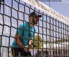 Paddle tennis player in the net
